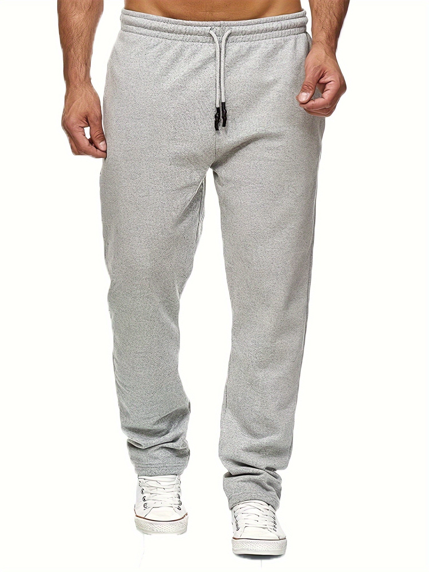 Stay comfy and warm in these men's solid color fleece-lined joggers! -
