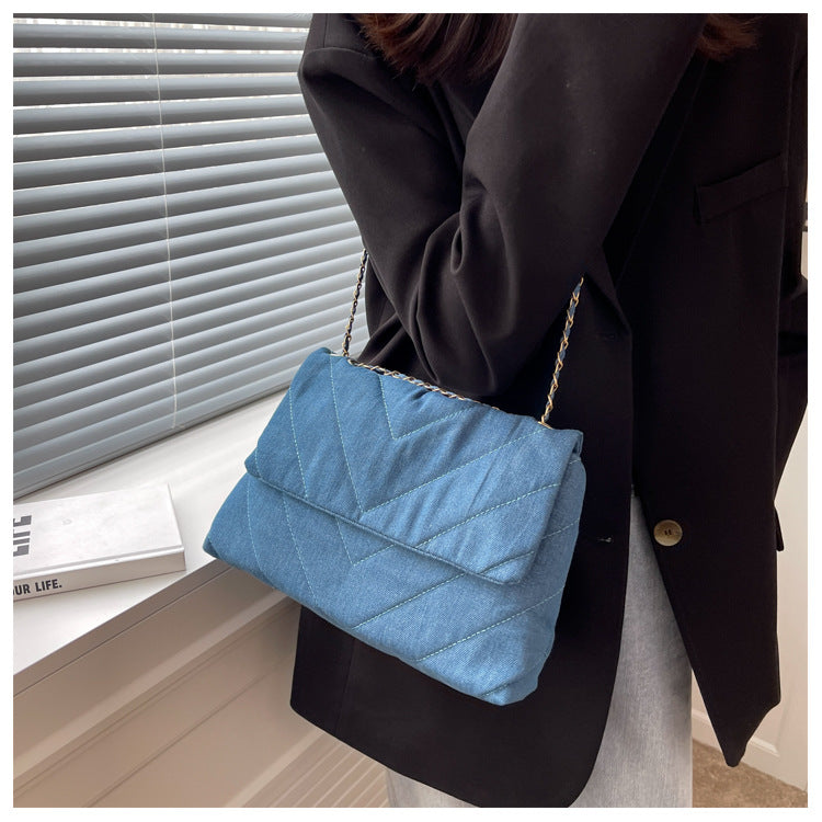 Elevate your style with this fashion luxury denim blue shoulder bag for women. Designed as a briefcase, this handbag is a chic and stylish accessory for a sophisticated and classy look. -