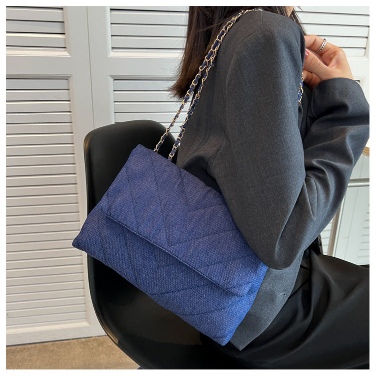 Elevate your style with this fashion luxury denim blue shoulder bag for women. Designed as a briefcase, this handbag is a chic and stylish accessory for a sophisticated and classy look. -