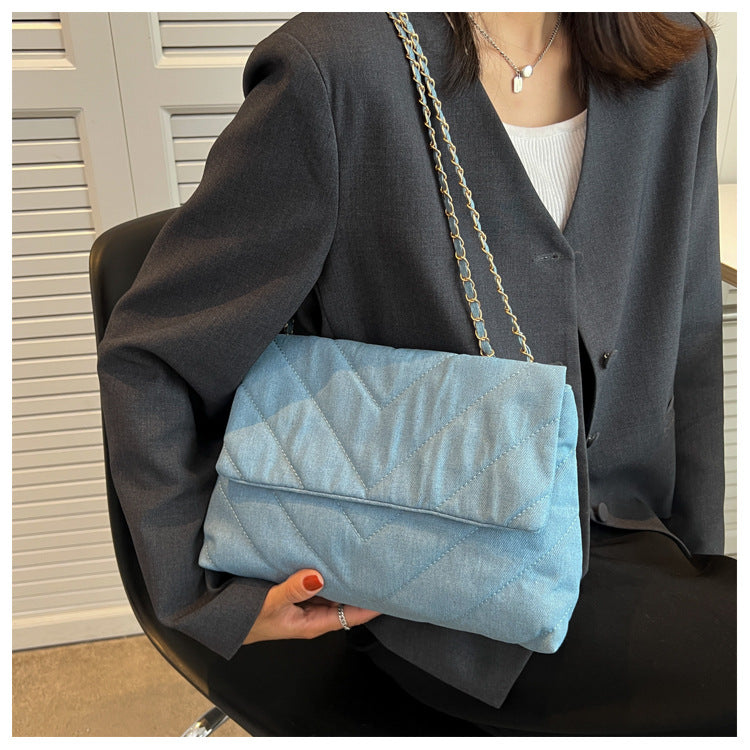 Elevate your style with this fashion luxury denim blue shoulder bag for women. Designed as a briefcase, this handbag is a chic and stylish accessory for a sophisticated and classy look. -