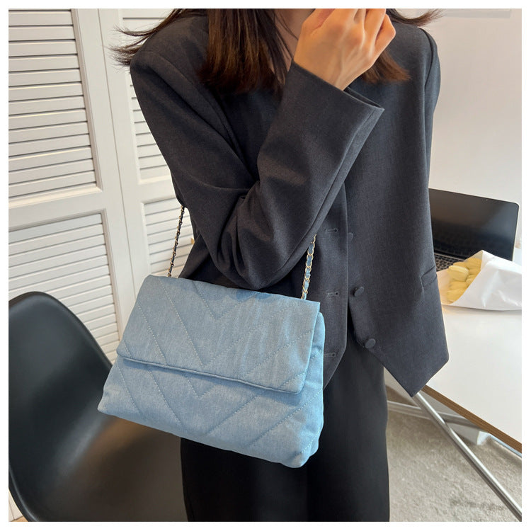 Elevate your style with this fashion luxury denim blue shoulder bag for women. Designed as a briefcase, this handbag is a chic and stylish accessory for a sophisticated and classy look. -