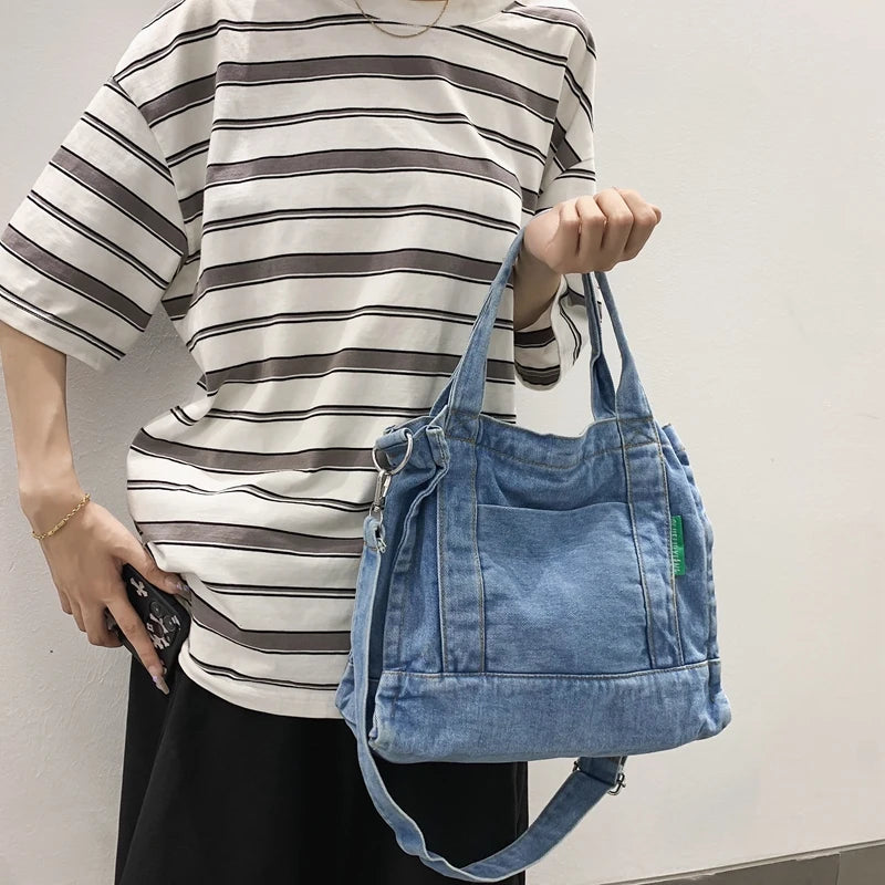 Elevate your casual look with this denim shoulder bag for women. Featuring a large design and zipper closure, this bag is perfect for shopping and everyday use, adding a touch of style to your outfit. -