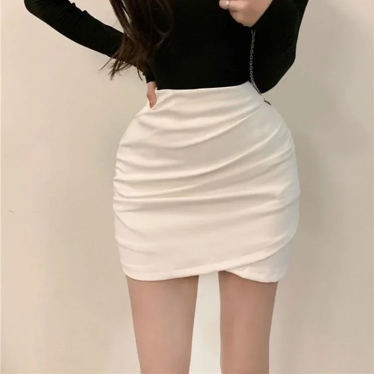 Turn heads with this girl's high-waist slim-fit short skirt featuring an irregular pleated hip design—sexy, versatile, and perfect for juniors! -
