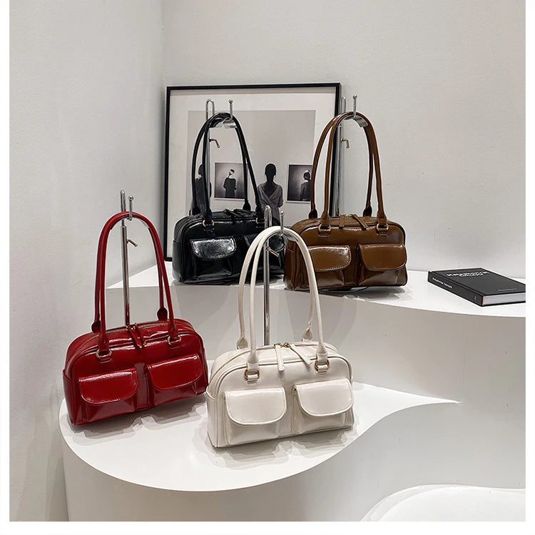 Accessorize stylishly with this black shoulder bag for women. This versatile handbag can be carried as a purse or a crossbody bag, making it a chic and practical choice for all occasions. -