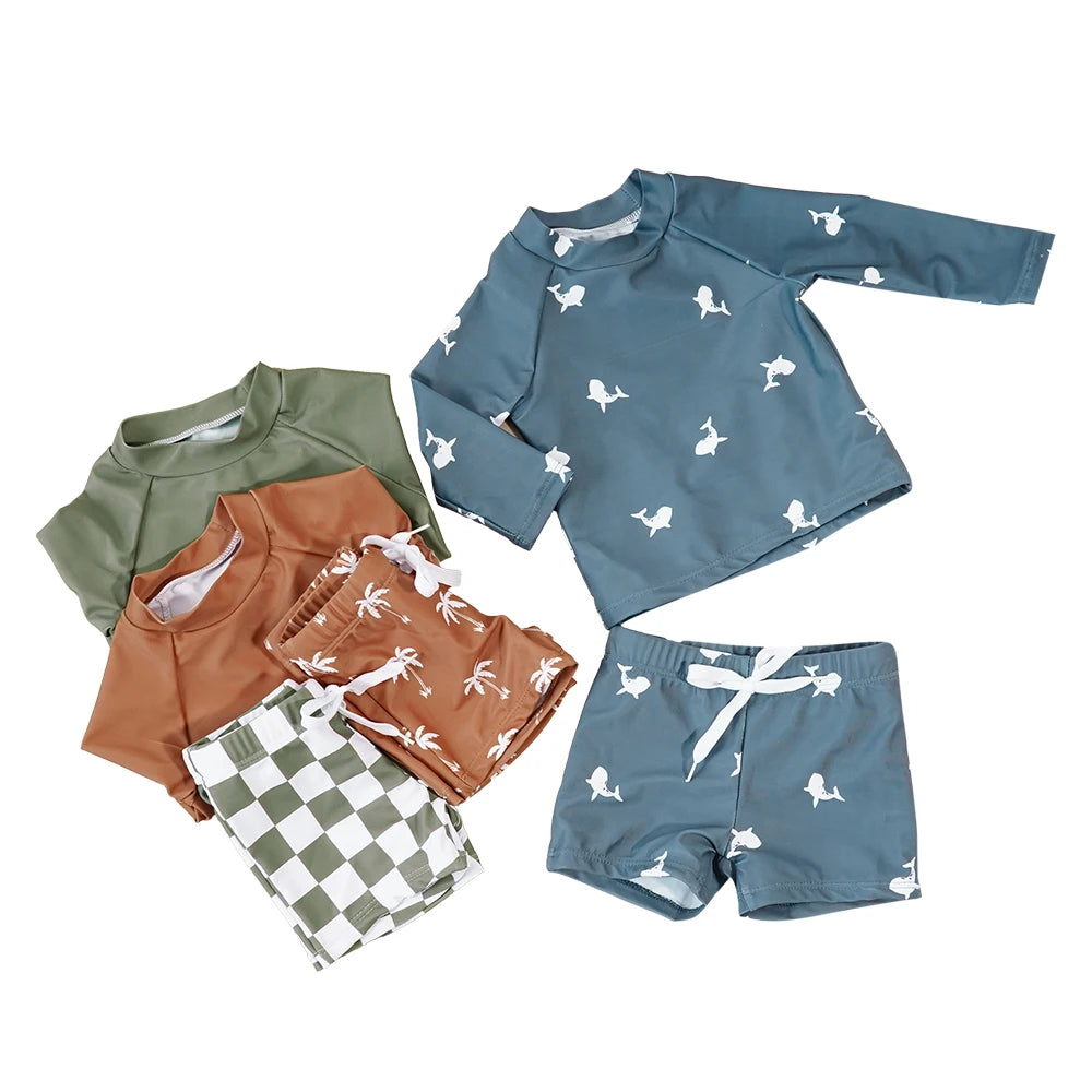 Make a splash in style with this fashionable and cute long-sleeve swimsuit for baby boys and girls—perfect for pool days and swim fun! -