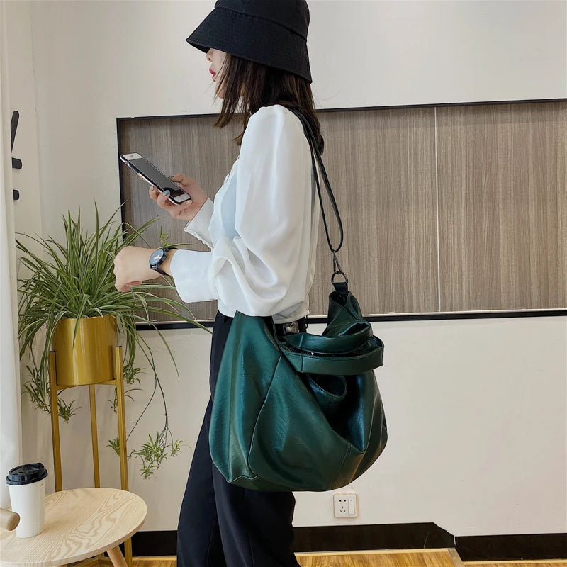 Make a stylish statement with these large shoulder bags designed for women. Crafted from soft leather, these fashionable handbags are perfect for adding a touch of sophistication to any outfit. -