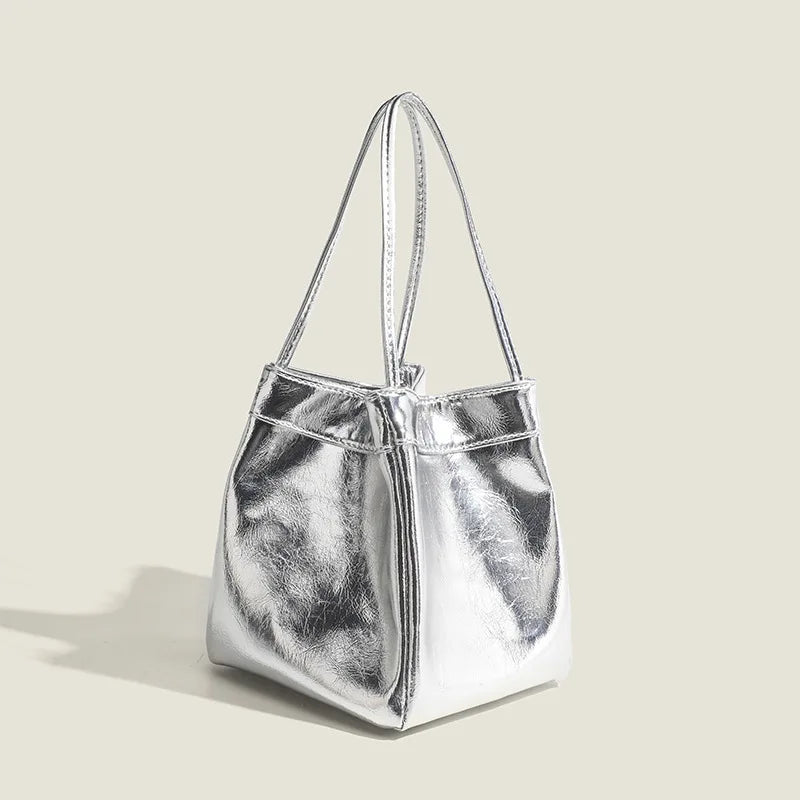 Stay on-trend with this bucket bag—a new fashion staple that offers simplicity, versatility, and a touch of classic style to elevate your wardrobe! -