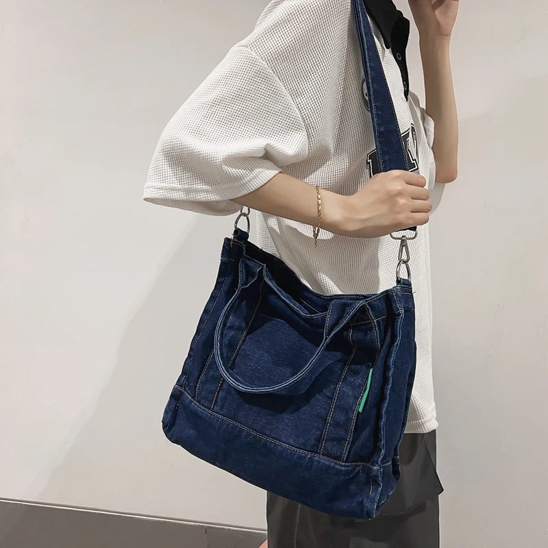 Elevate your casual look with this denim shoulder bag for women. Featuring a large design and zipper closure, this bag is perfect for shopping and everyday use, adding a touch of style to your outfit. -