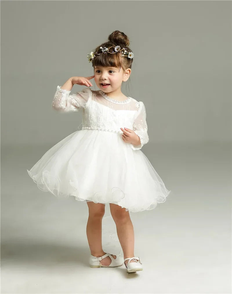 Make your baby girl shine in this elegant long-sleeve white party dress—perfect for special occasions! -