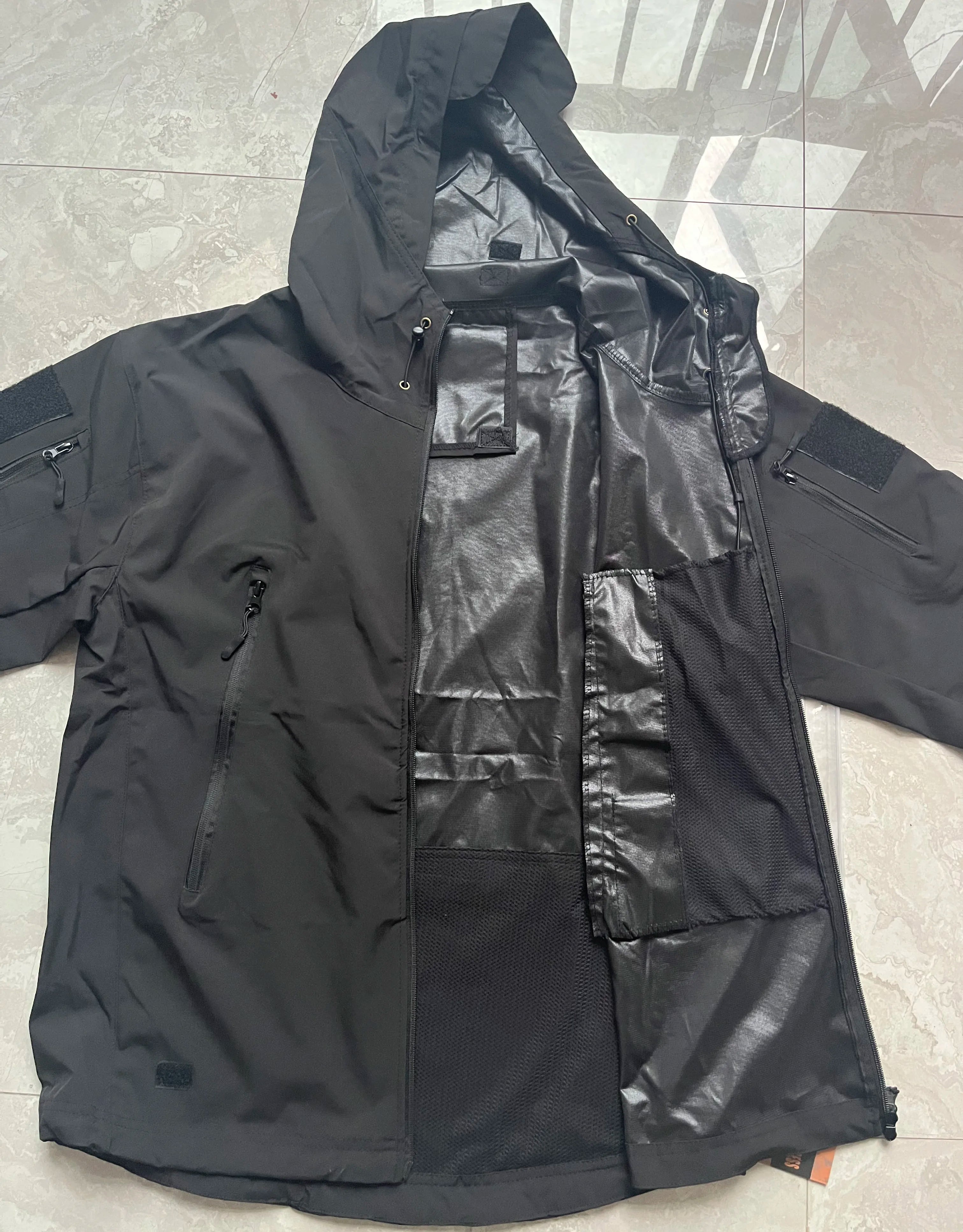 Stay prepared for any weather conditions with this tactical windproof and waterproof jacket for men. This versatile and durable jacket is perfect for outdoor activities and ensuring optimal protection from the elements. -