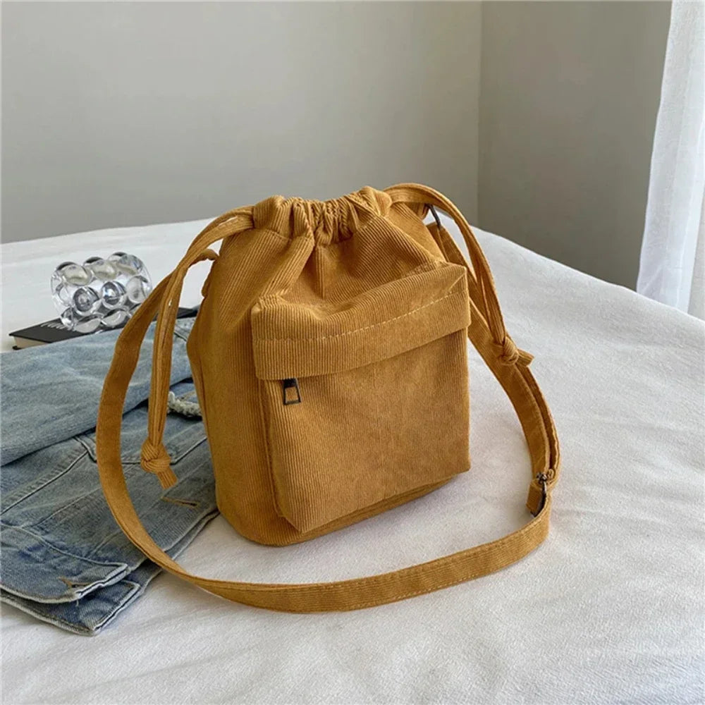 Carry your essentials in style with this cute middle shoulder drawstring bucket bag—a versatile and fashionable accessory for women on the go! -
