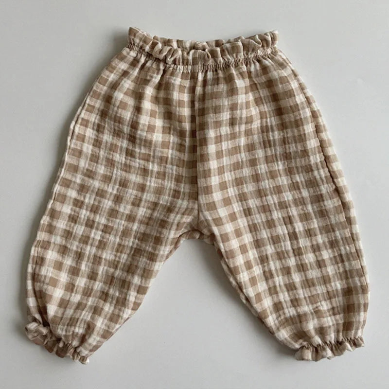Keep your little ones comfy and cute in these organic cotton loose-fit baby pants—featuring playful tiger, bear, and floral prints perfect for boys and girls! -