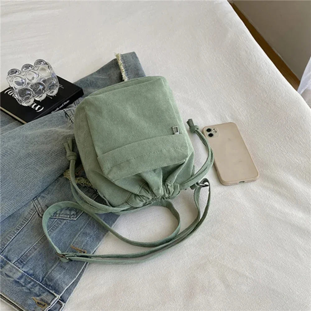 Carry your essentials in style with this cute middle shoulder drawstring bucket bag—a versatile and fashionable accessory for women on the go! -