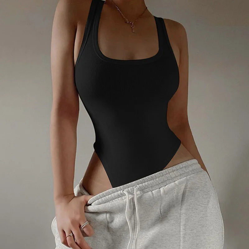 Achieve a hot and sexy look with this sleeveless knit bodysuit featuring an off-shoulder halter design. Perfect for making a stylish and alluring statement! -
