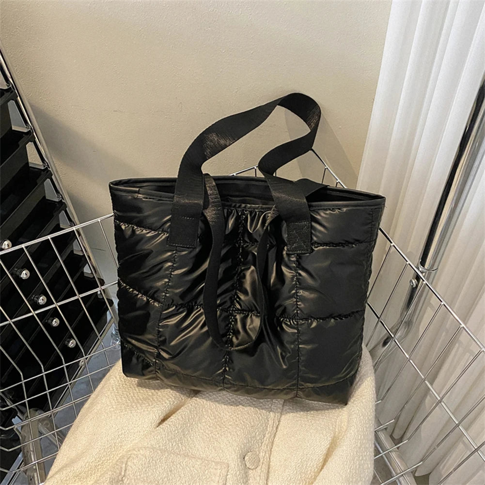 Stay stylish and organized with this fashion women's tote bag. Featuring a large capacity and cotton-padded design, this chic accessory is perfect for women who prioritize both style and functionality in their handbag. -