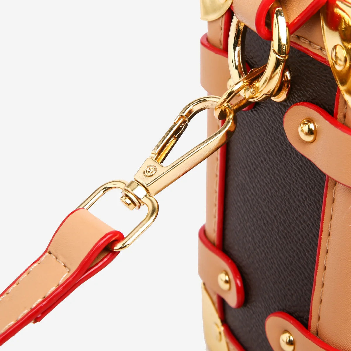 Make a statement with this luxurious and elegant box bag for women. Crafted from high-quality leather, this shoulder handbag features an elegant top-handle design, exuding sophistication and style for a classy finishing touch to your ensemble. -