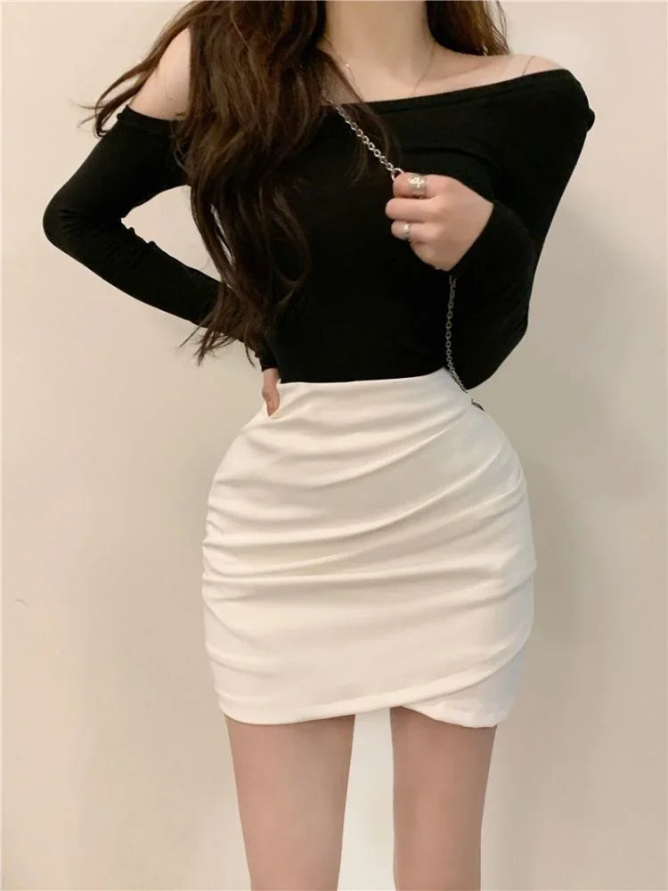 Turn heads with this girl's high-waist slim-fit short skirt featuring an irregular pleated hip design—sexy, versatile, and perfect for juniors! -