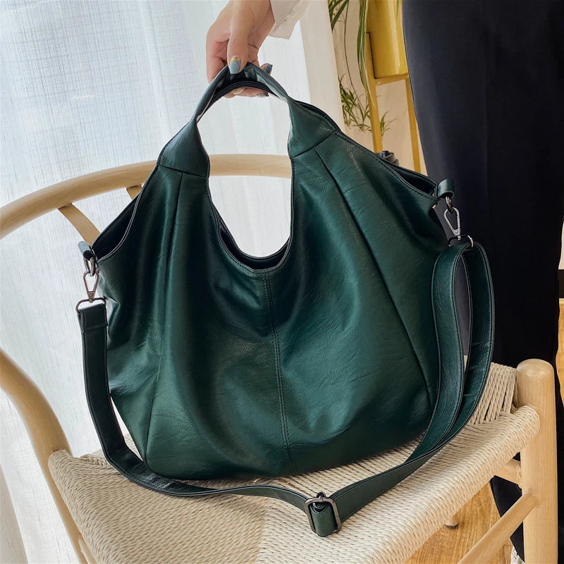 Make a stylish statement with these large shoulder bags designed for women. Crafted from soft leather, these fashionable handbags are perfect for adding a touch of sophistication to any outfit. -