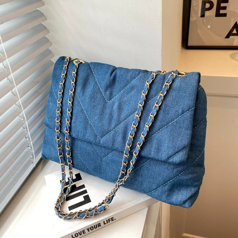 Elevate your style with this fashion luxury denim blue shoulder bag for women. Designed as a briefcase, this handbag is a chic and stylish accessory for a sophisticated and classy look. -