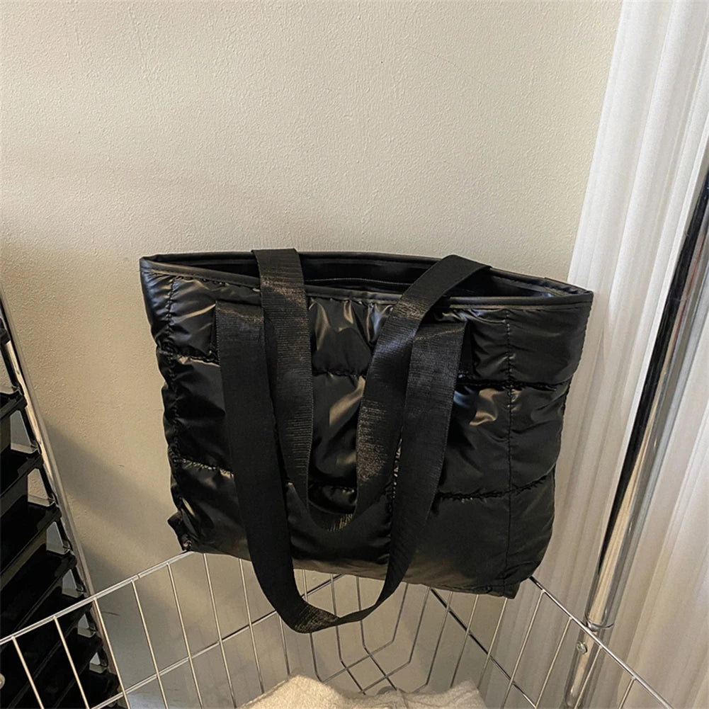 Stay stylish and organized with this fashion women's tote bag. Featuring a large capacity and cotton-padded design, this chic accessory is perfect for women who prioritize both style and functionality in their handbag. -