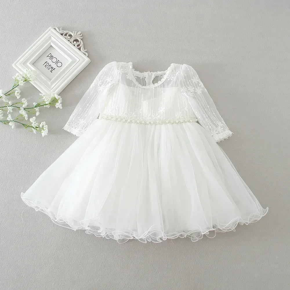 Make your baby girl shine in this elegant long-sleeve white party dress—perfect for special occasions! -