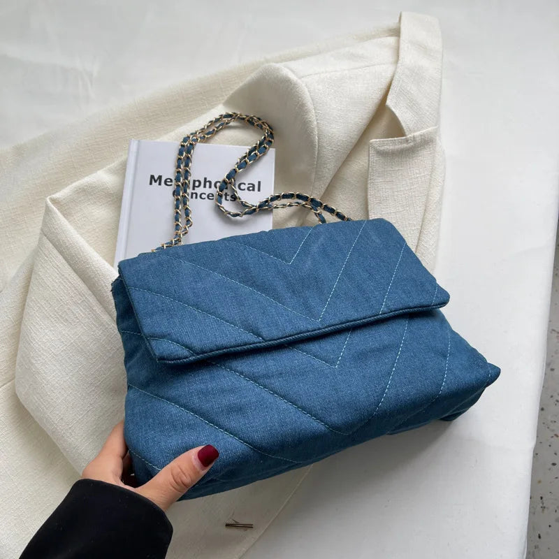 Elevate your style with this fashion luxury denim blue shoulder bag for women. Designed as a briefcase, this handbag is a chic and stylish accessory for a sophisticated and classy look. -