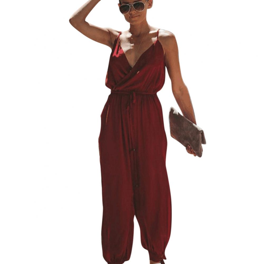 Dress to impress in this sexy and stylish women's summer jumpsuit. Featuring a backless design, deep V-neckline, floral print, and strappy details, this romper is perfect for making a statement with your outfit! -