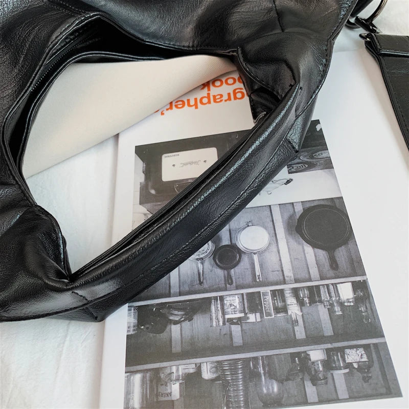 Make a stylish statement with these large shoulder bags designed for women. Crafted from soft leather, these fashionable handbags are perfect for adding a touch of sophistication to any outfit. -