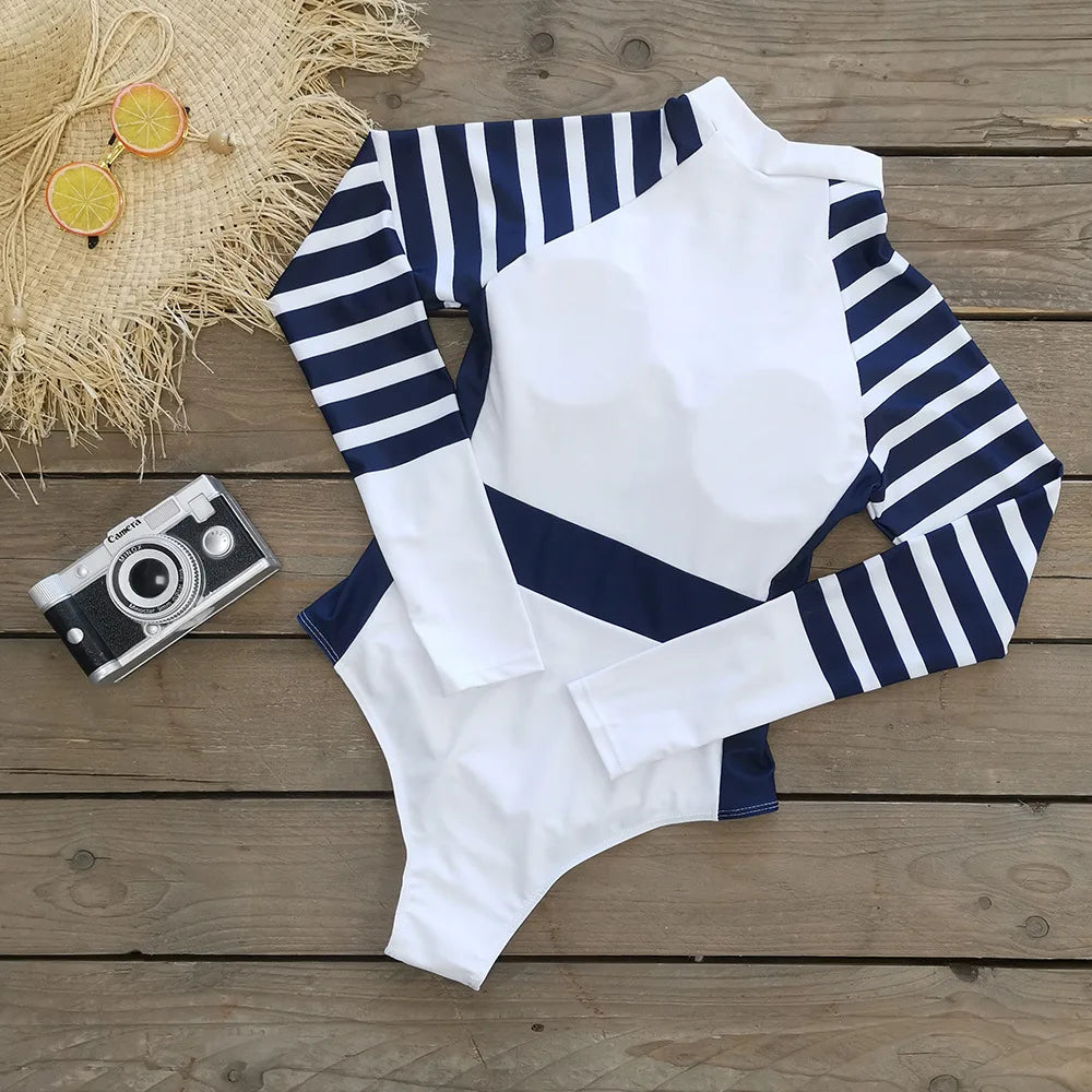 Stay stylish and protected from the sun in this long-sleeved one-piece swimwear for women! -