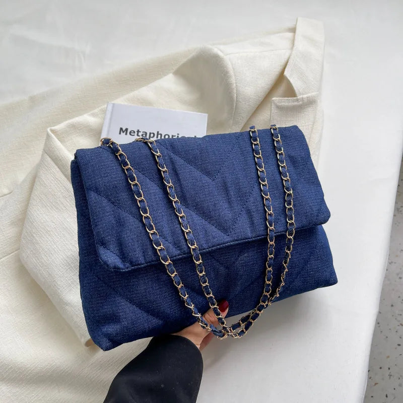 Elevate your style with this fashion luxury denim blue shoulder bag for women. Designed as a briefcase, this handbag is a chic and stylish accessory for a sophisticated and classy look. -
