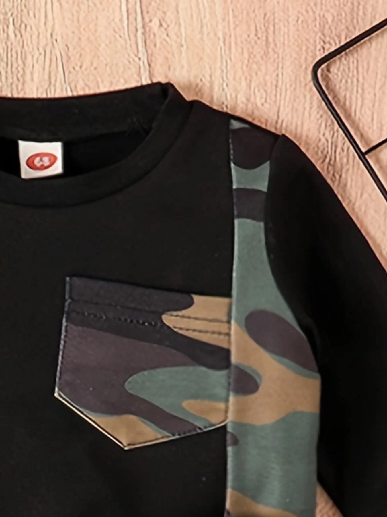 Dress your little guy sharp and comfy with this two-piece baby boy set—long-sleeved round neck top paired with stylish camouflage pants! -