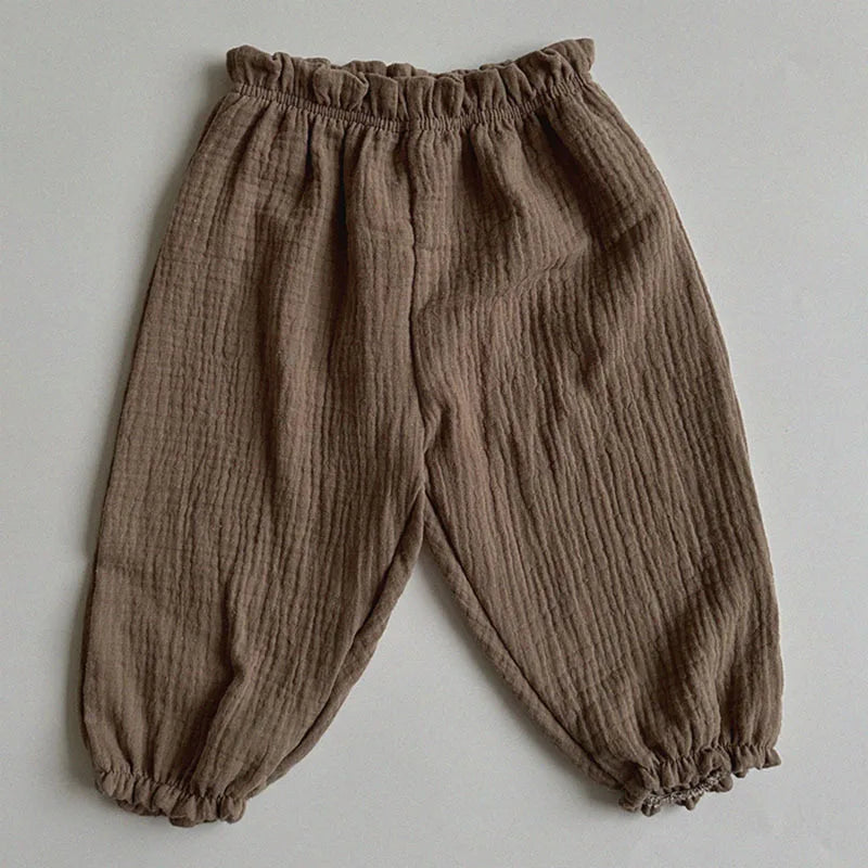 Keep your little ones comfy and cute in these organic cotton loose-fit baby pants—featuring playful tiger, bear, and floral prints perfect for boys and girls! -