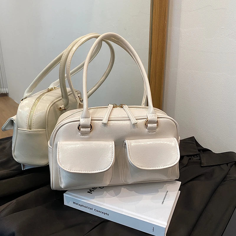 Accessorize stylishly with this black shoulder bag for women. This versatile handbag can be carried as a purse or a crossbody bag, making it a chic and practical choice for all occasions. -
