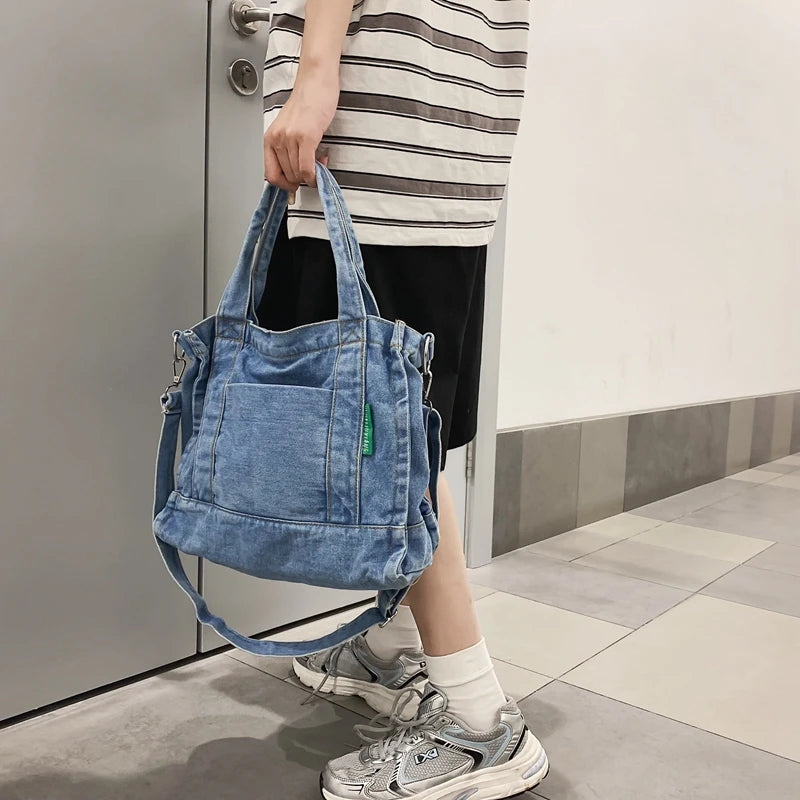 Elevate your casual look with this denim shoulder bag for women. Featuring a large design and zipper closure, this bag is perfect for shopping and everyday use, adding a touch of style to your outfit. -