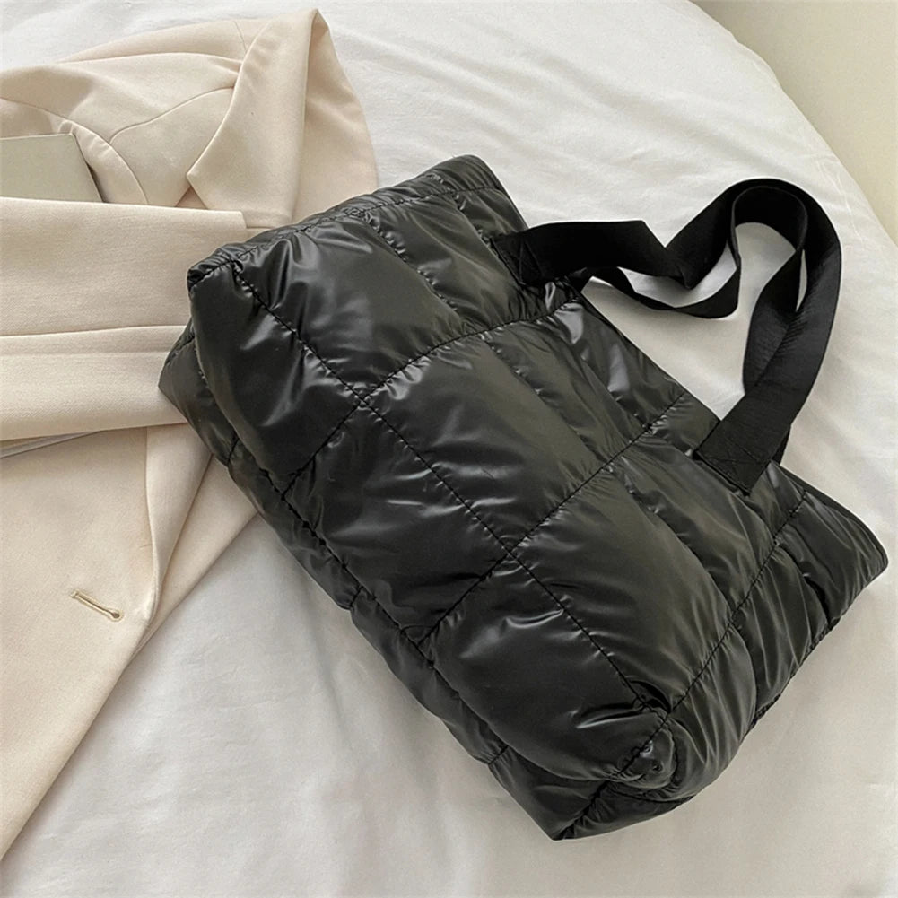 Stay stylish and organized with this fashion women's tote bag. Featuring a large capacity and cotton-padded design, this chic accessory is perfect for women who prioritize both style and functionality in their handbag. -