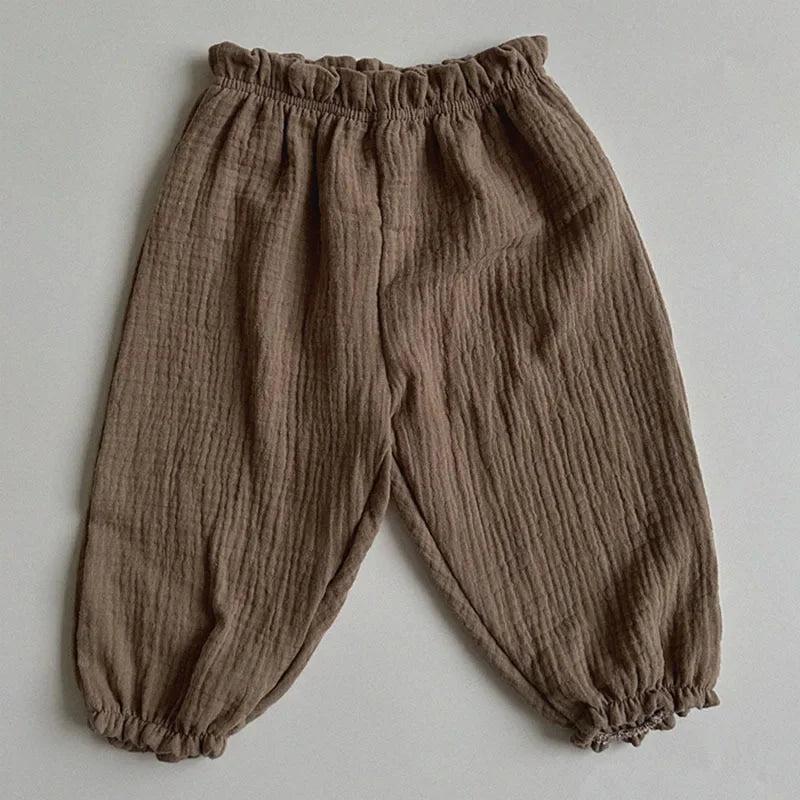 Keep your little ones comfy and cute in these organic cotton loose-fit baby pants—featuring playful tiger, bear, and floral prints perfect for boys and girls! -