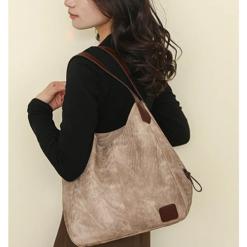 Stay organized and stylish with this large work tote bag for women. Designed with designer PU leather, this big bucket bag is perfect for carrying all your essentials in a chic and fashionable way. -