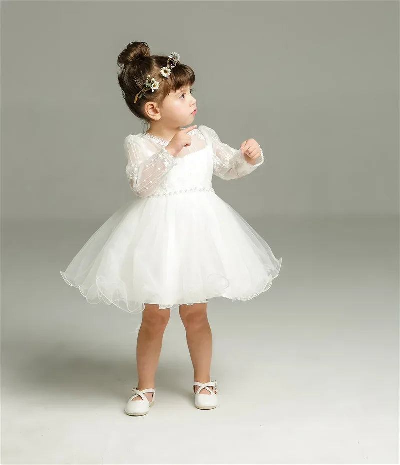 Make your baby girl shine in this elegant long-sleeve white party dress—perfect for special occasions! -