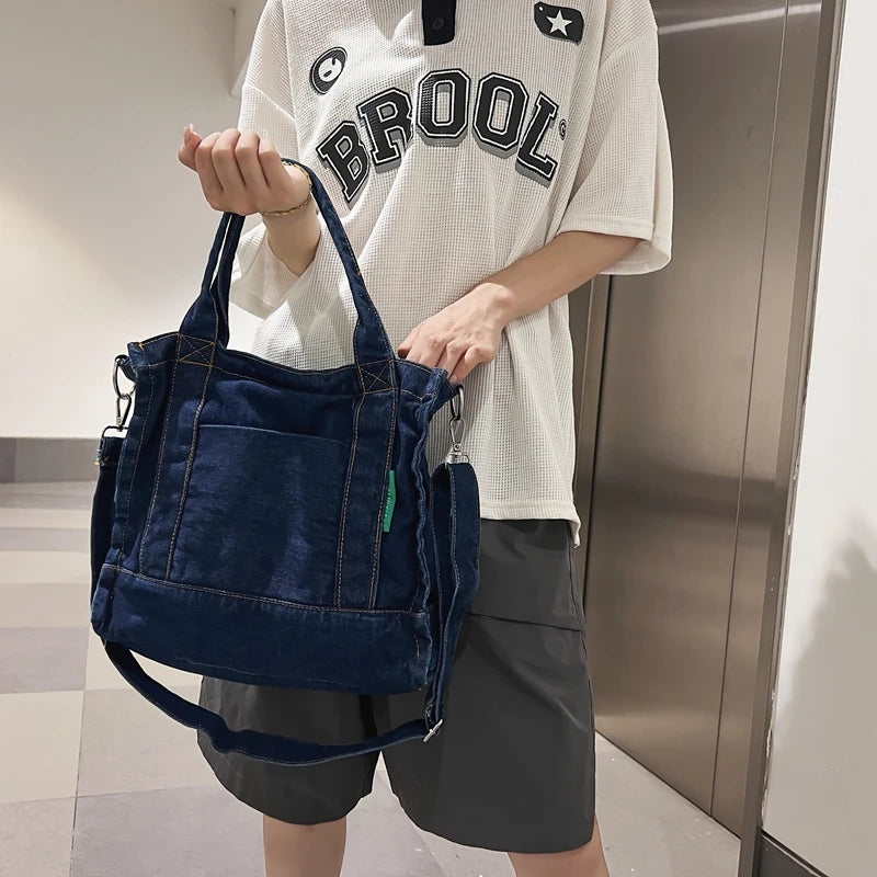 Elevate your casual look with this denim shoulder bag for women. Featuring a large design and zipper closure, this bag is perfect for shopping and everyday use, adding a touch of style to your outfit. -