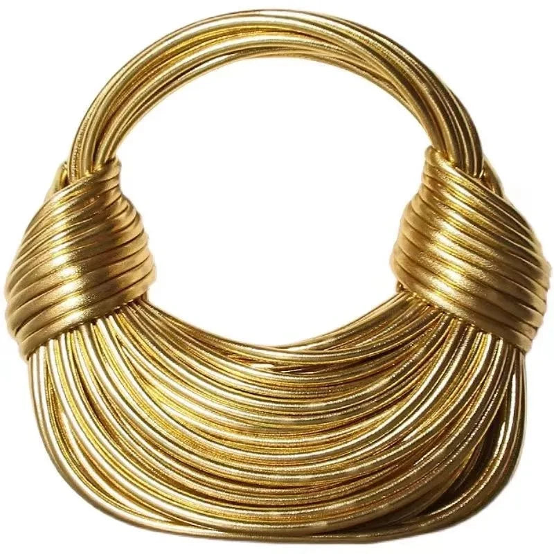 Make a statement with this gold luxury designer brand handwoven noodle bag. With a rope-knotted hobo design and a chic silver evening clutch, this bag is the epitome of high fashion and sophistication. -