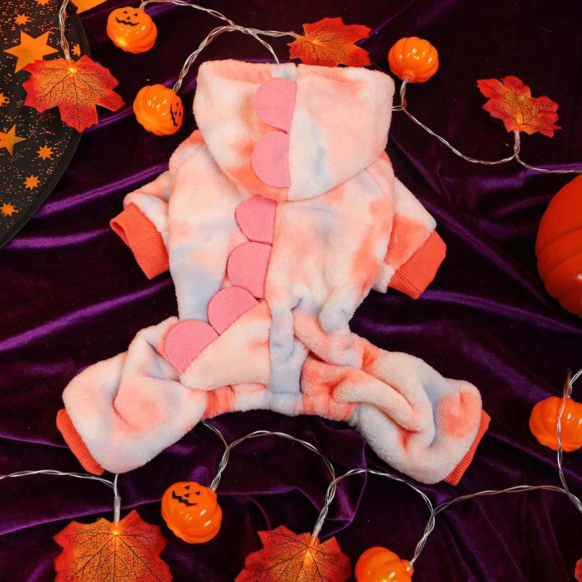 Dress your pet in adorable dinosaur-themed clothes to keep them warm and cozy. -
