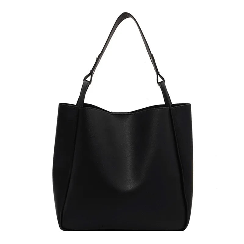Elevate your style with these retro-inspired bucket shoulder bag made of real leather. -