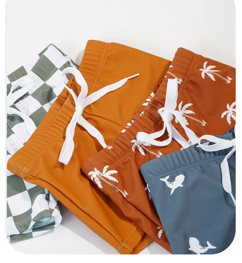 Make a splash in style with this fashionable and cute long-sleeve swimsuit for baby boys and girls—perfect for pool days and swim fun! -