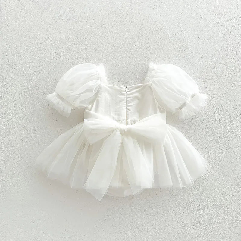 Dress your toddler in sweet style with this new baby lace dress featuring a big bowknot and short sleeves—perfect for special occasions! -