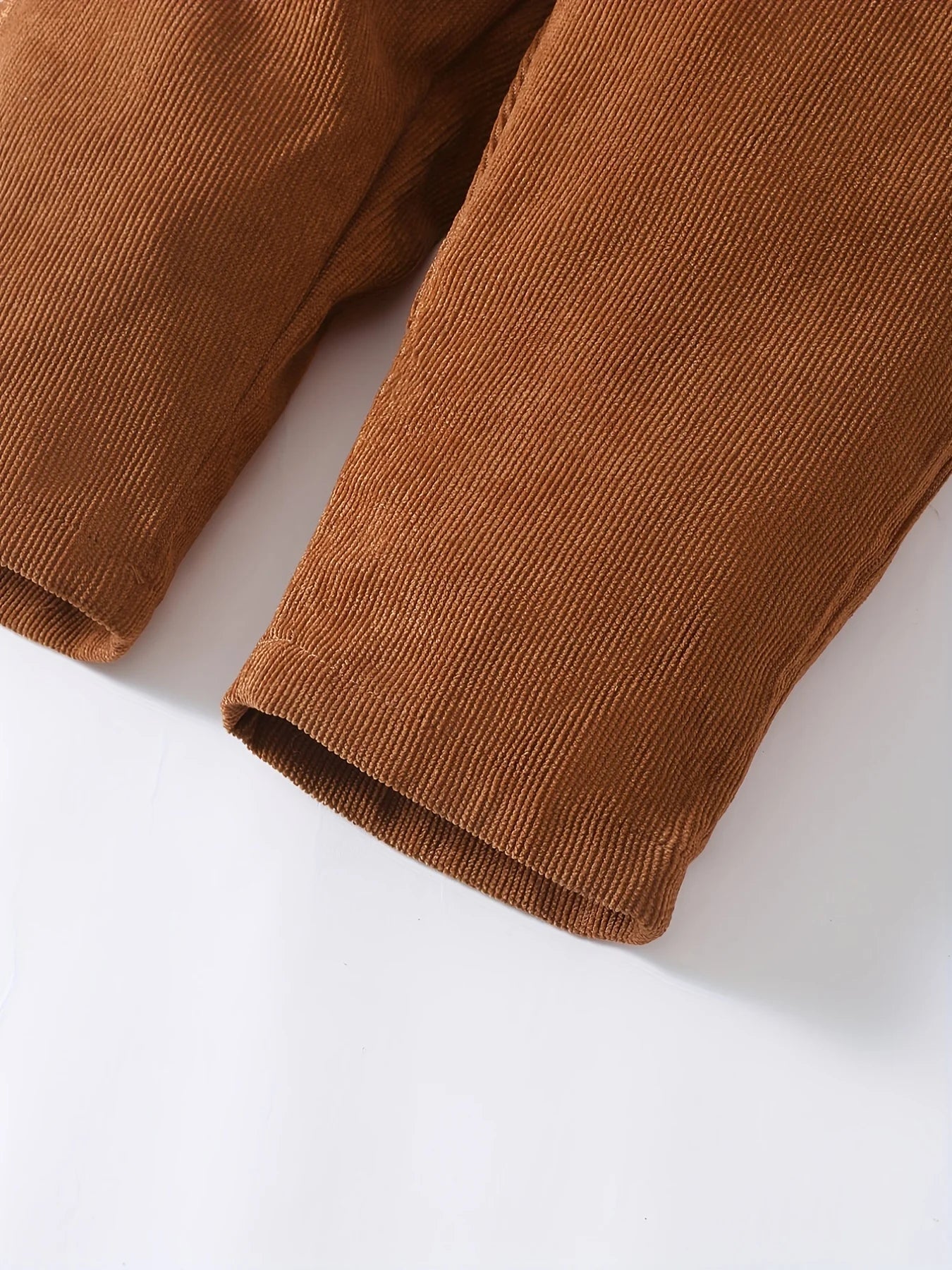 Dress your toddler boy or girl in cozy style with these brown corduroy strap pants—perfect for everyday comfort and cuteness 0-3 Years! -