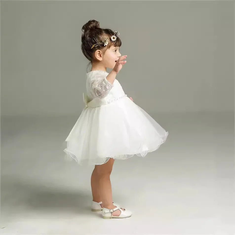 Make your baby girl shine in this elegant long-sleeve white party dress—perfect for special occasions! -
