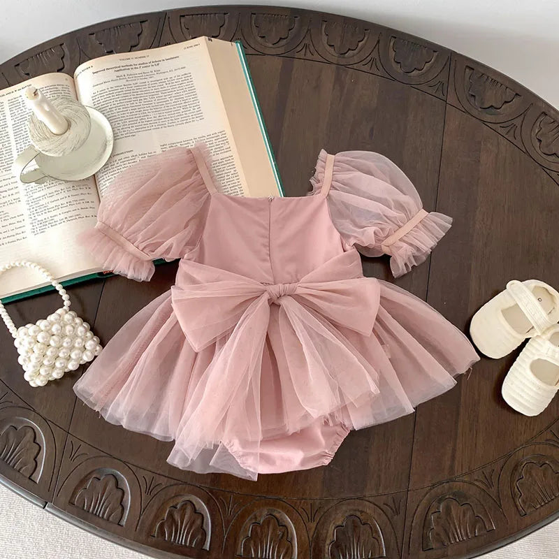 Dress your toddler in sweet style with this new baby lace dress featuring a big bowknot and short sleeves—perfect for special occasions! -