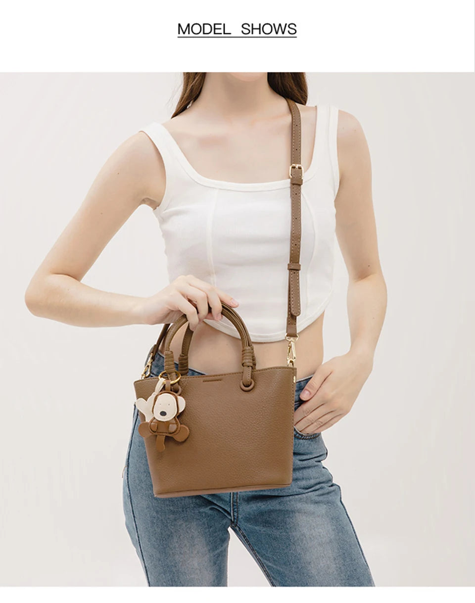 Upgrade your accessories with this new bucket bag for women. Featuring a fashionable and versatile design, this handheld bag is perfect for adding a chic and trendy touch to your look. -