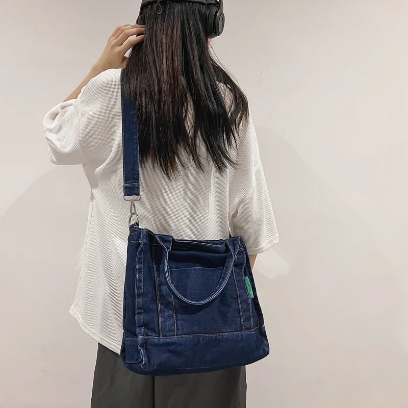 Elevate your casual look with this denim shoulder bag for women. Featuring a large design and zipper closure, this bag is perfect for shopping and everyday use, adding a touch of style to your outfit. -