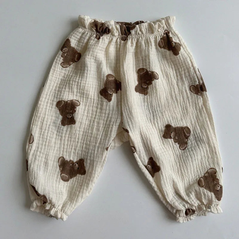 Keep your little ones comfy and cute in these organic cotton loose-fit baby pants—featuring playful tiger, bear, and floral prints perfect for boys and girls! -